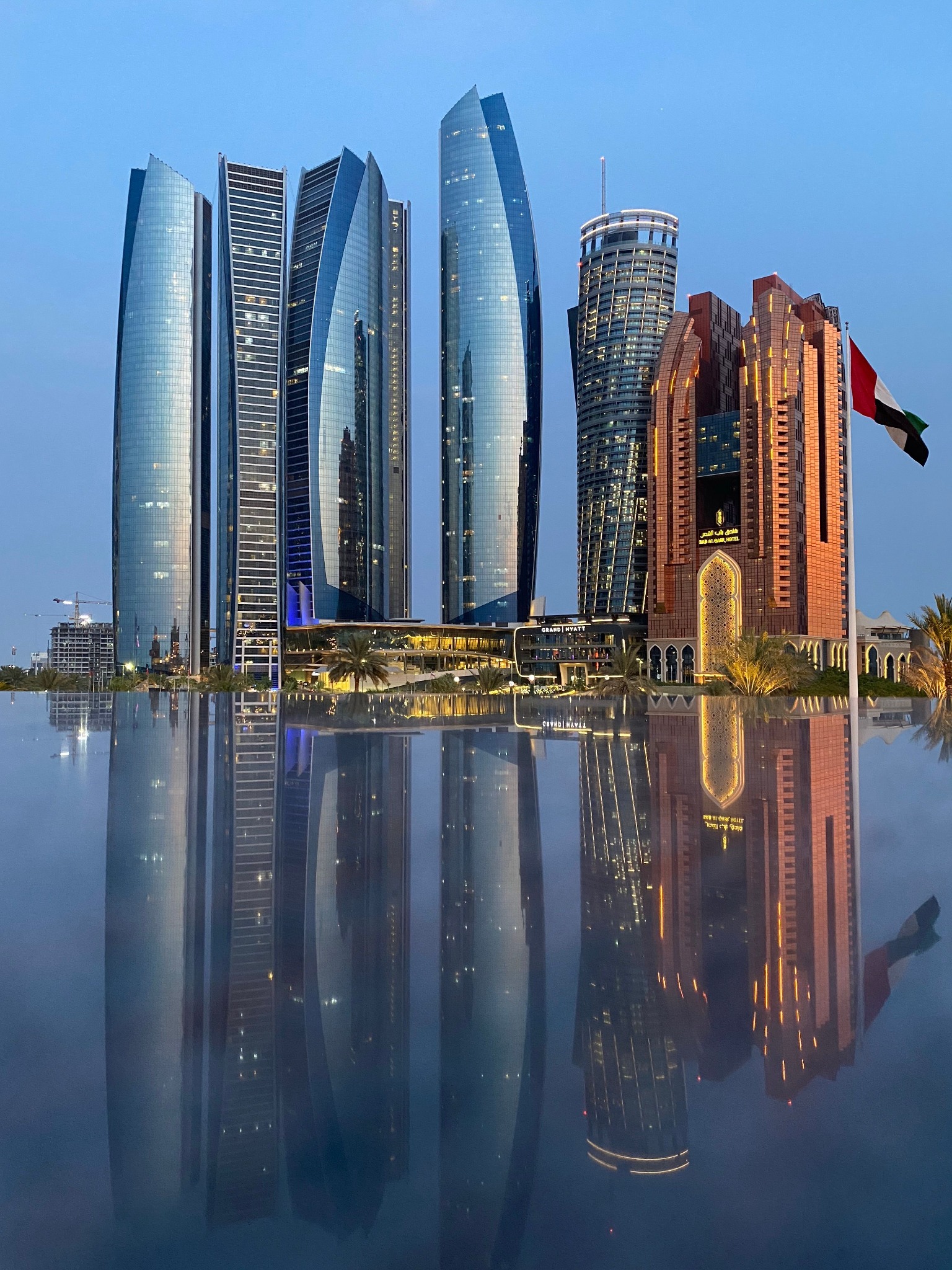Etihad Towers in Abu Dhabi reflected in water